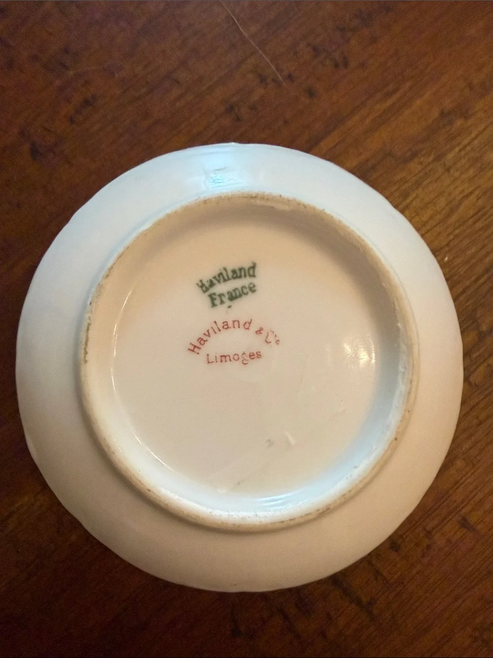 Haviland Limoges butter pat 3” with a beautiful scalloped edge